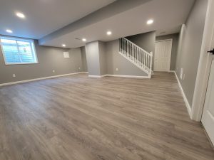 Clean, empty residential basement with finished walls and flooring, illustrating a well-maintained basement in an Edmonton home.